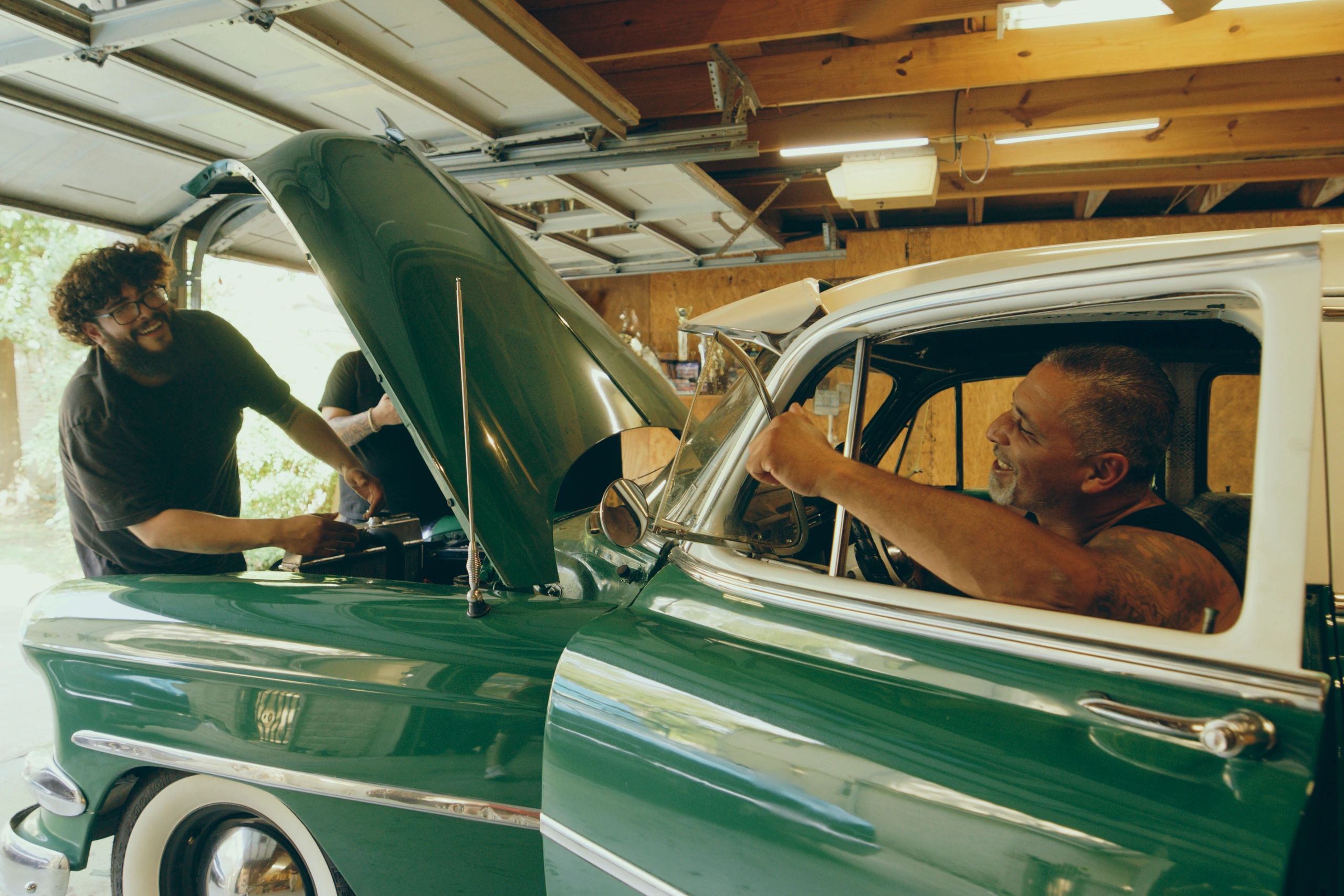 Classic car being restored by skilled mechanics